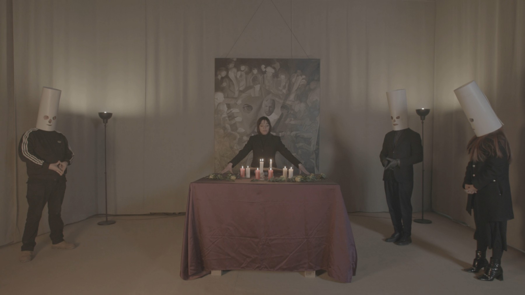 The Séance: a masked participant, the medium, and John Robinson around a candlelit table in Venice.